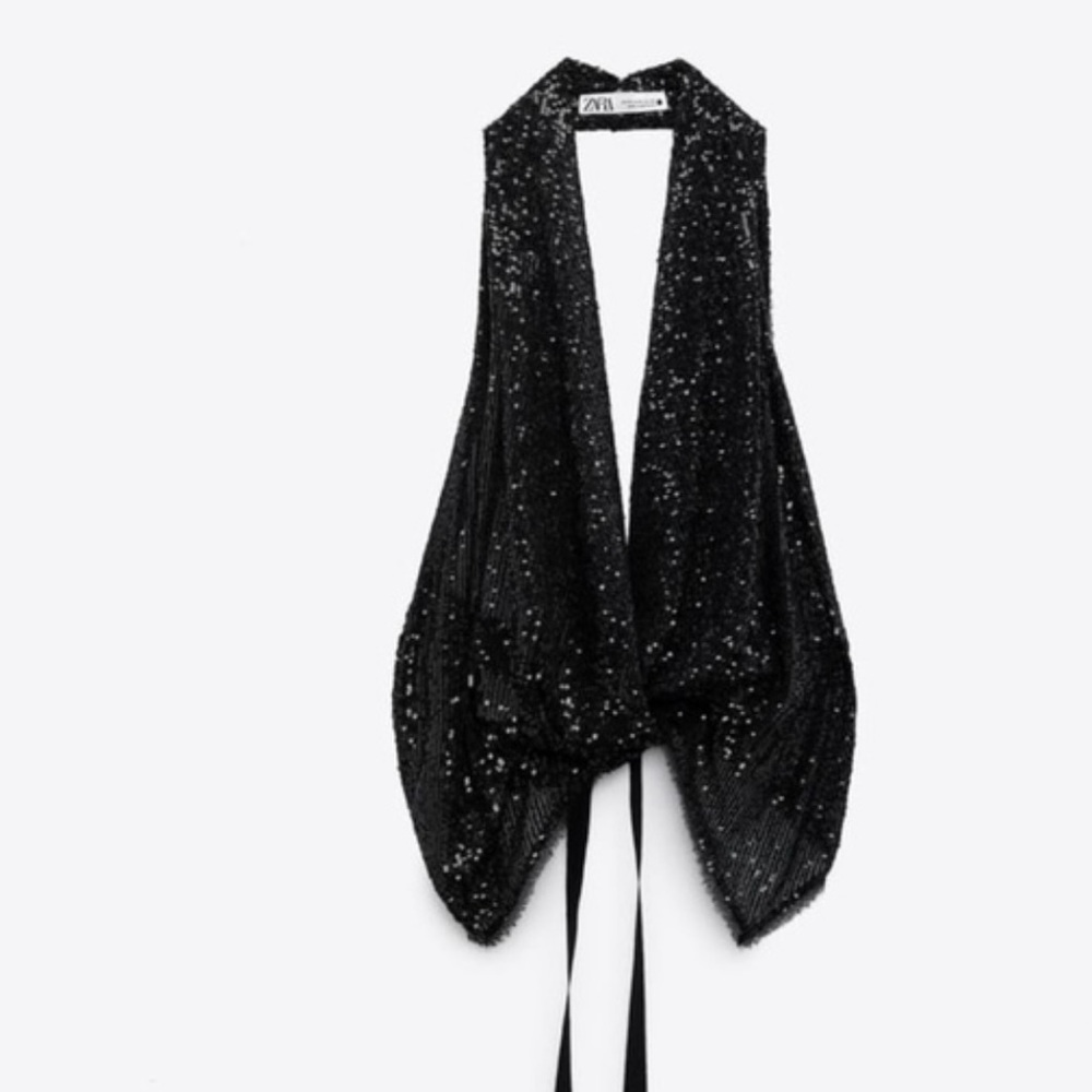 Size medium sequin backless top fits size small-medium.